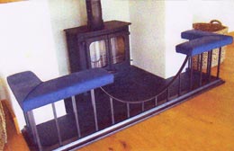 Burnished steel fender seat – wood burner